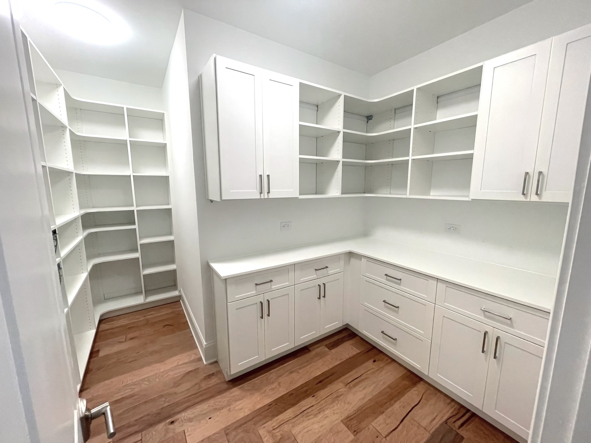 Custom Closets of GA Pantry with wire, pull-out baskets, white cabinetry, counter space, and soft-close drawers.