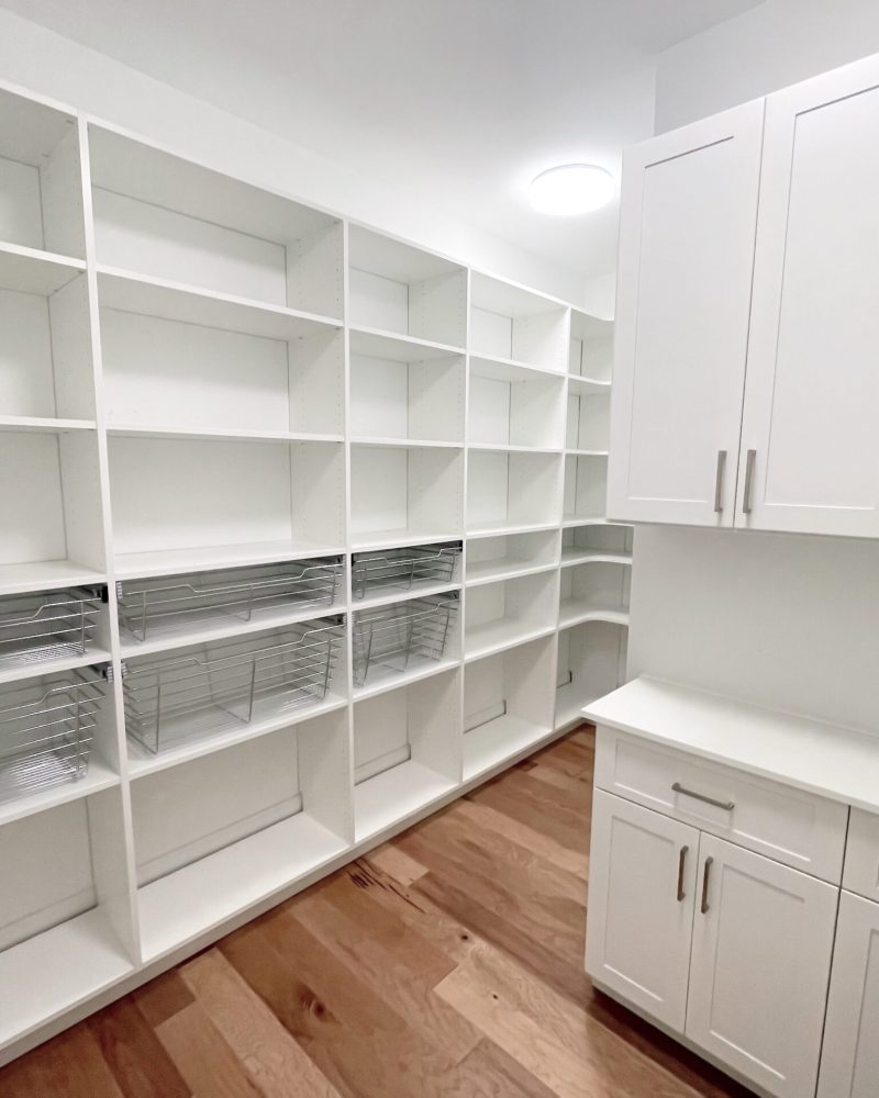 Custom Closets of GA Pantry with wire, pull-out baskets, white cabinetry, counter space, and soft-close drawers.